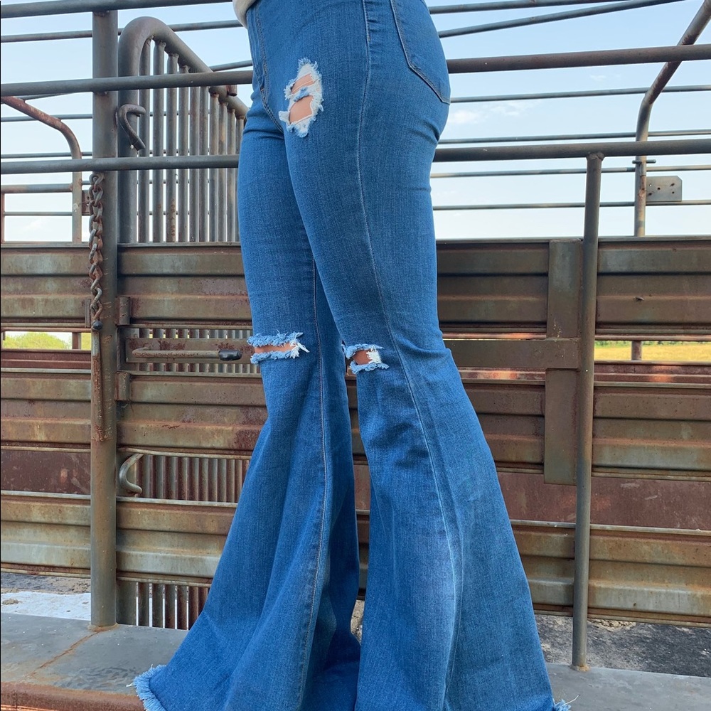 “Make a statement distressed bell bottoms”